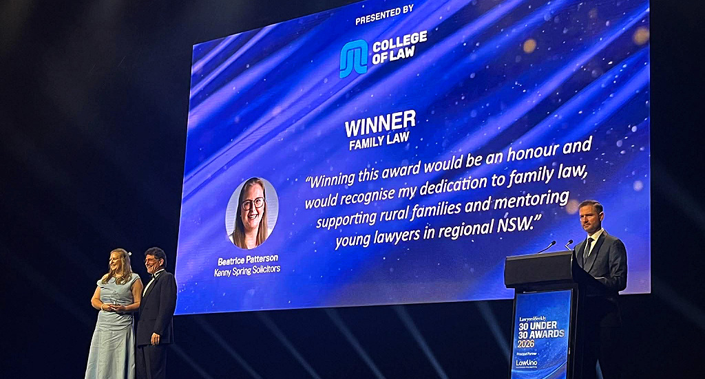 Senior Solicitor Beatrice Patterson accepts the award on stage at Star Casino